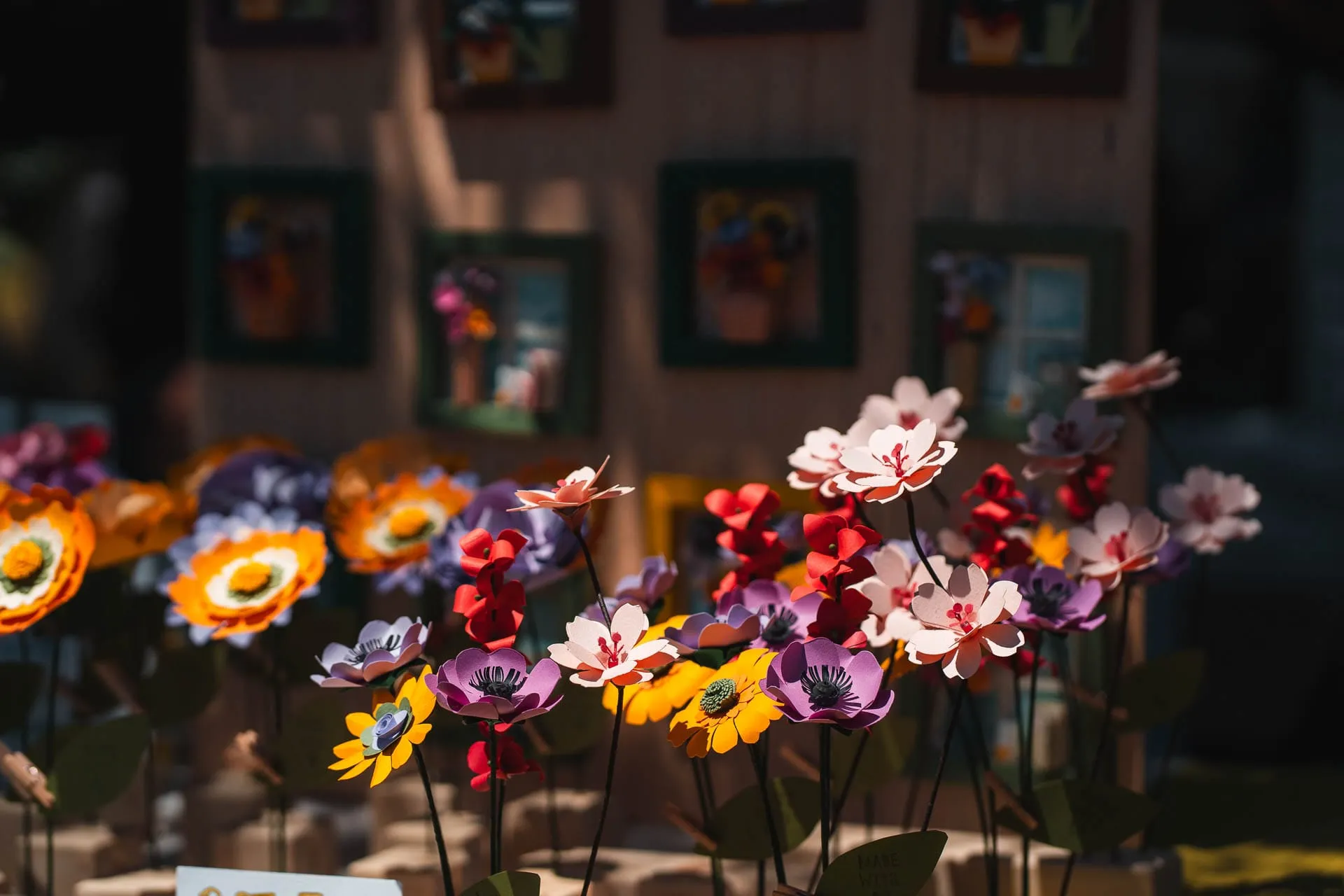 Colourful handmade flowers on display