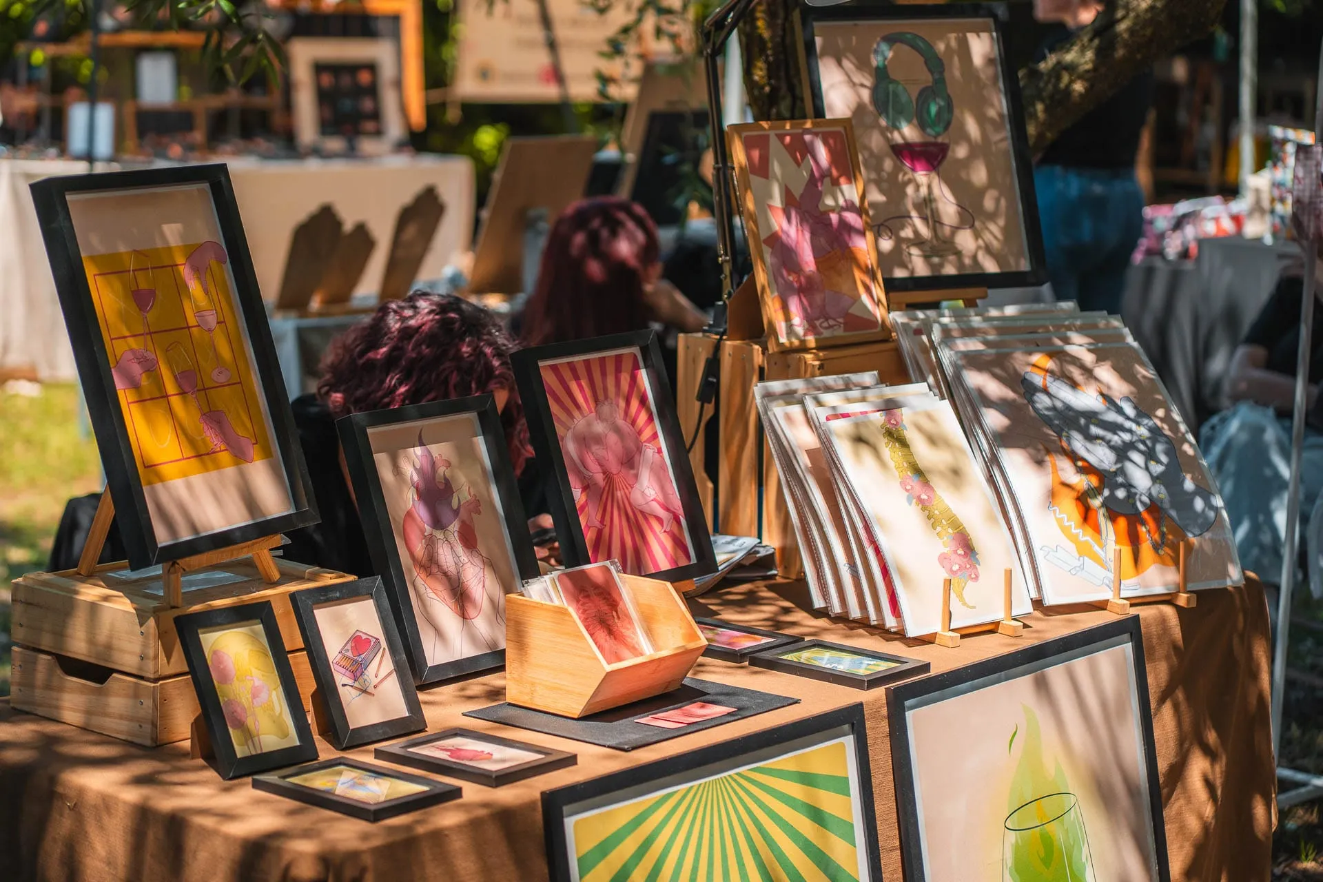 Framed prints and illustrations on a stall