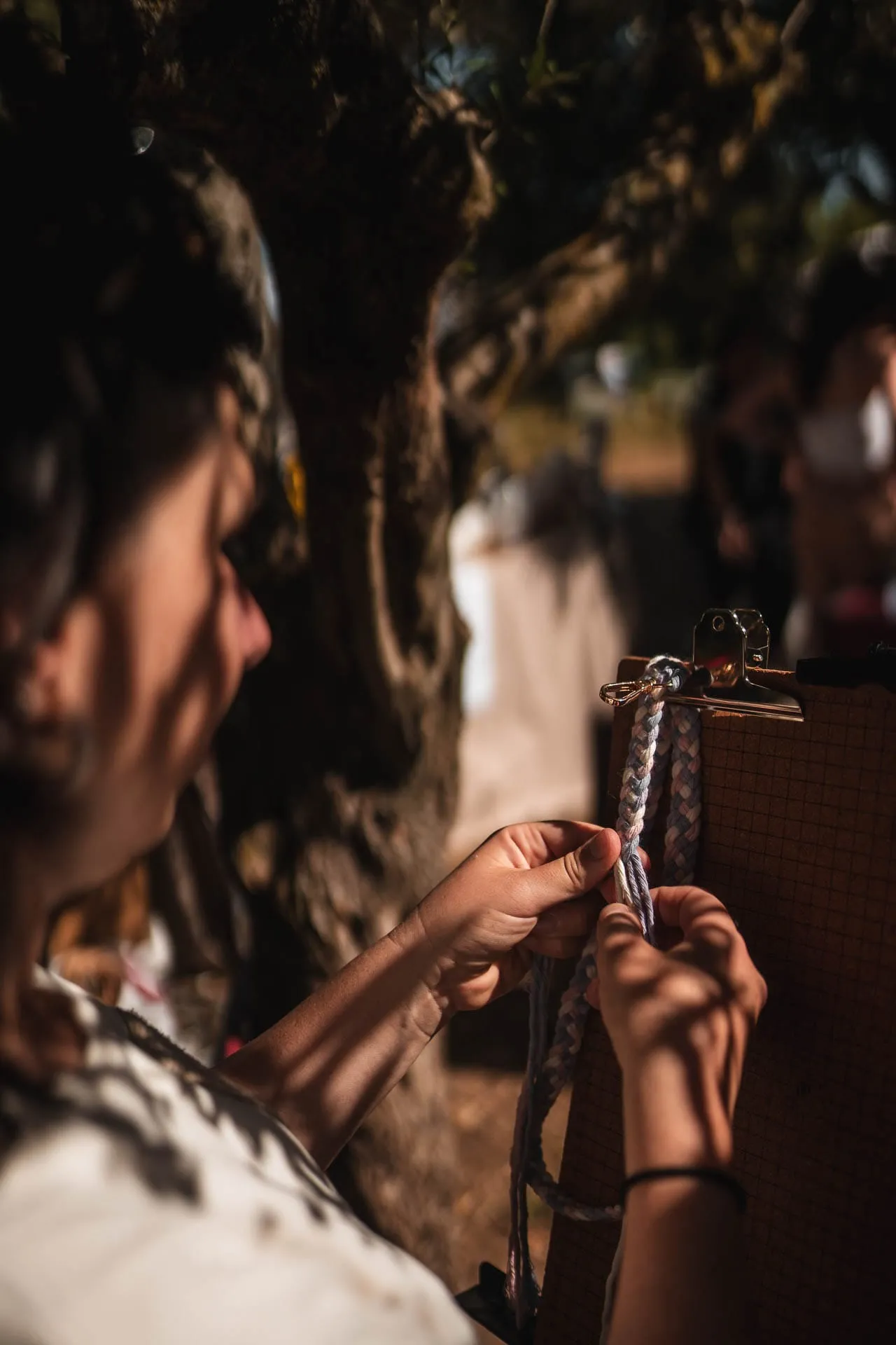 A visitor looks at an accessory hanging at a stall