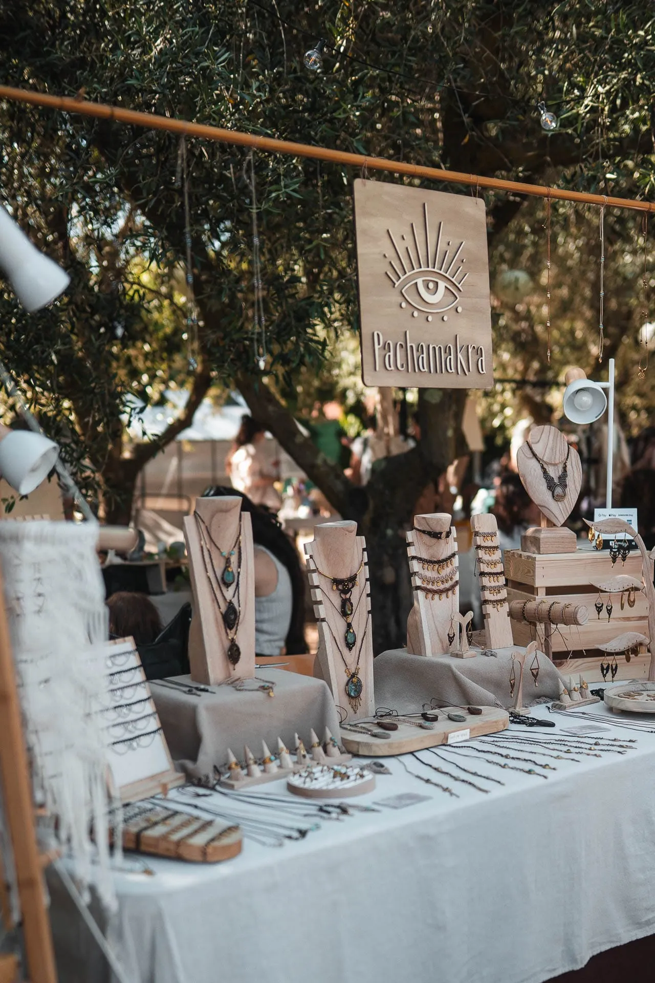A jewellery stall under the olive trees